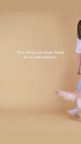 Load and play video in Gallery viewer, Woman walking a golden retriever and cleaning its paws with Lumi-noble Cleansing Pet Wipes
